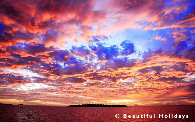 photograph of sunset over uninhabited island in Fiji